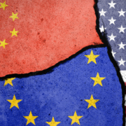 Flags of US, EU and China painted on cracked wall